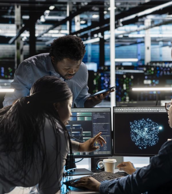 Data center engineering team implements AI virtualization frameworks to optimize server clusters. Teamworking server hub colleagues do artificial intelligence predictive analysis